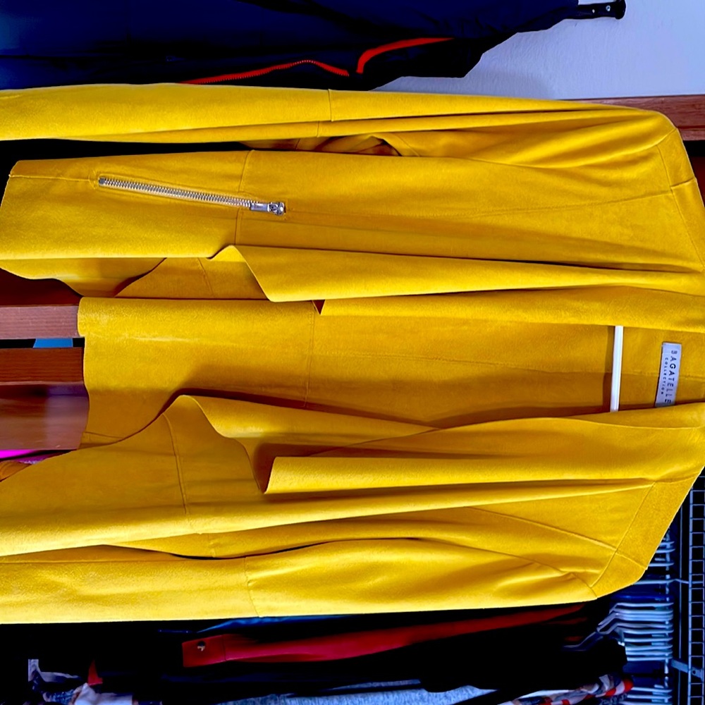 Mustard yellow blazer type with pockets. Super cute. Long sleeved.